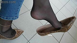 Isabelle-Sandrine's balcony show in snake skin stilettos