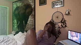 Naejae sits alone, rubbing her wet twat while watching hot lesbian porn on her screen.