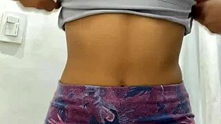 Cute Teen Lifts Skirt for Playful Tease