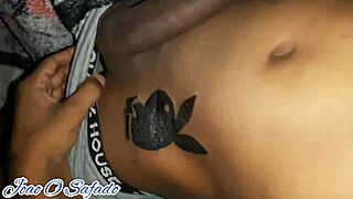 Young guy shows off for new Playboy tattoo.