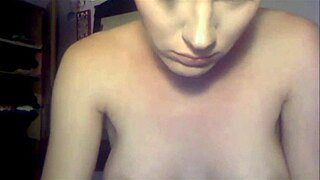 Stunning shemale with short hair performs on webcam, showcasing her transsexual beauty.