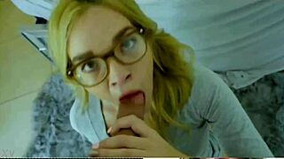 Blonde woman with glasses engages in a blowjob scene in this narrative.