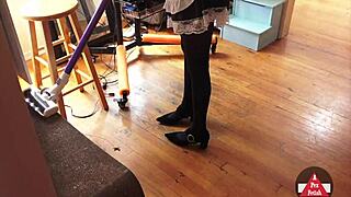 French maid in cosplay vacuums the house
