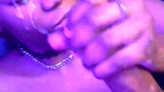 This pretty ebony couple engages in sex, licking, and a big cumshot facial