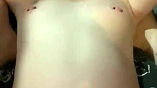 amateur couple films a raw sextape with pierced nipples on display.