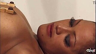 Madame Noir and Maxine XS share an intimate moment together.