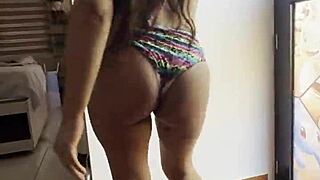 A latina woman dances, showcasing her big ass in this video.