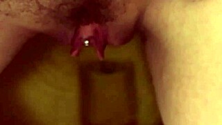 my pretty pierced brunette pees in bathroom