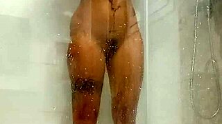 hot teen gets horny in the shower, using her toy for masturbation