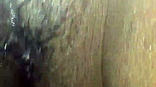 Ebony plays with wet pussy using vibrator