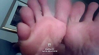 Barefoot flexible girl flexes feet close-up for fetish