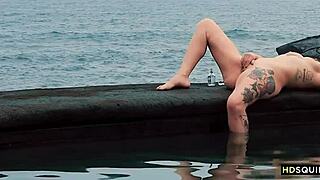 I am a free spirit girl squirting by the shore with my tattooed ass and natural tits.