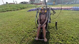 Priscila belini flies naked on paramotor and masturbates in the air.