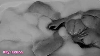 Curvy mature Kitty Hudson bathes with vibrator for orgasm