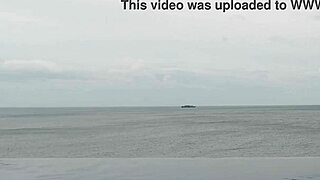 skinny student with cute legs relaxes by the infinity pool