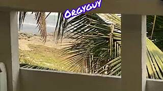 Woman flashes at beach resort outdoors