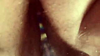 Solo hairy beaver glass dildo close up.