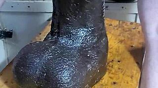 Mature woman stretches with huge dildos