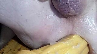 Mature woman stretches with huge dildos