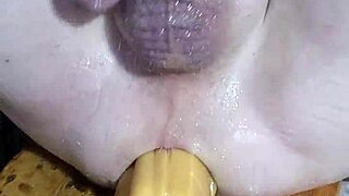 Mature woman stretches with huge dildos