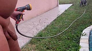 jarrose waters the plants naked in the garden