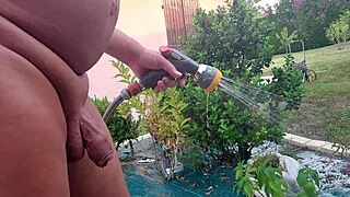 jarrose waters the plants naked in the garden