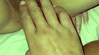 Asian girl at home masturbates her big wet pussy, wondering how it fits a cock.