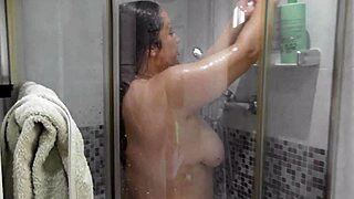 Hey, check out this busty madrastra in the shower. I'm watching her big natural tits and wet pussy while jerking off!