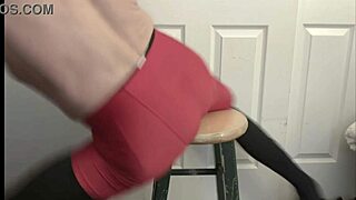 Grinding hard on stool in black compression tights and red shorts!