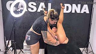 tattooed artist licks the ass of her muscular client until she moans and squirts in ecstasy