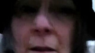 French housewife slave performs outdoor public exhibition with bondage and dildo masturbation in leather harness as humiliated maid