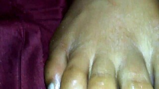 the ebony foot job unfolds with black cumshot and feet action in ebony elegance style.
