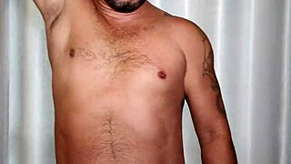 pornstar brasil shows off that brazilian bear's huge cock in a steamy shower