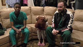 In the hospital room, a shaved nurse in latex gloves spanks the patient during a fetish backstage session. Her small tits peek out.