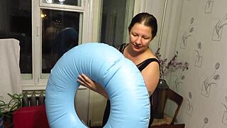 Milf engages in looner fetish by blowing and inflating the beach circle with big tits and ass.