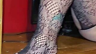 Sexy fishnets spread her ass cheeks wide open for viewing.