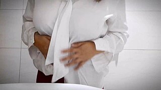 Horny office girl masturbates in bathroom showing big tits and tight pussy