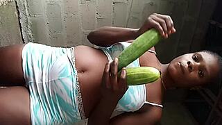 African teen teases pussy cucumber striptease