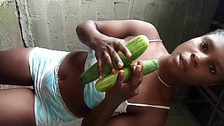 African teen teases pussy cucumber striptease
