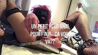 natatravesti plugs dildo in fishnets on bed