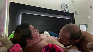 She sucks those huge natural tits hungrily