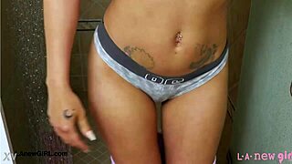 elegant tall brunette steps into steamy shower casually