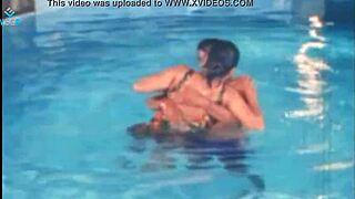 hot unmarried couple relaxes together at the pool