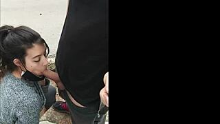 hot brunette gives sloppy public dick suck outdoors