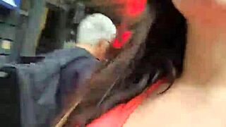 A Latina strolls publicly outdoors without panties flashing natural tits.