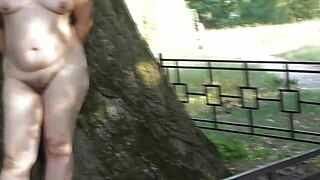 hairy chubby mature flashes her wet beaver outdoors