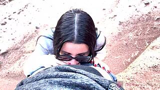 skinny teen with glasses gives deep pov blowjob in scenic canyon