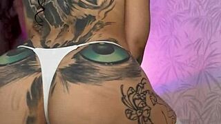 babe's split tongue licks pillow as she rubs pussy fucks ass closeup