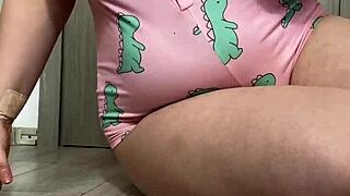 A horny teen brunette masturbates her big tits alone at home