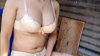 An amateur shemale masturbates nervously in open bathroom